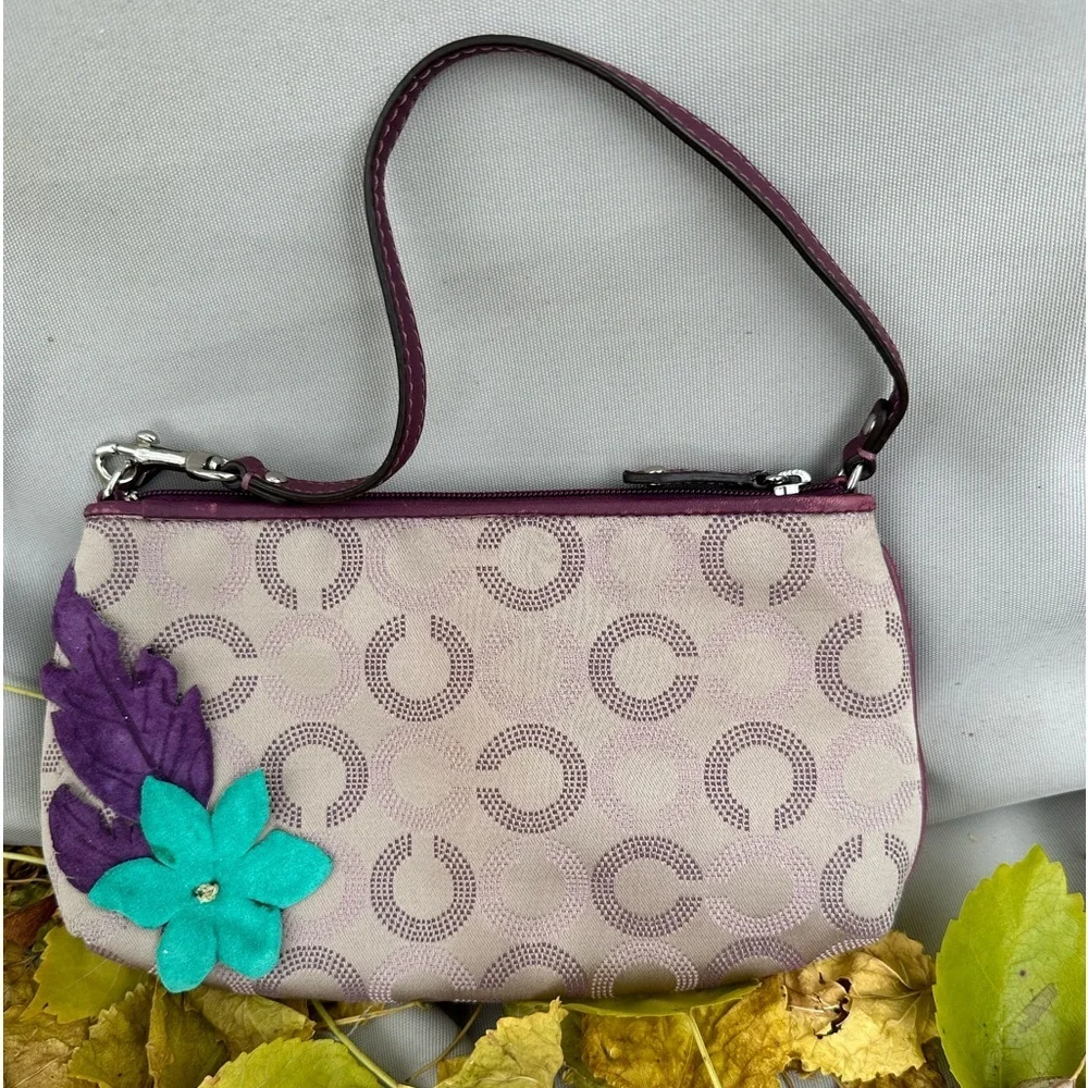 Coach Wristlet with suede flowers. Upstyled for a fresh new look. 9.25x5.5 x1”